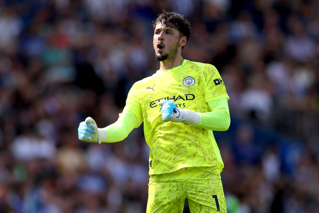 James Trafford pumps his fist during a Premier League game between Brighton and Manchester City.