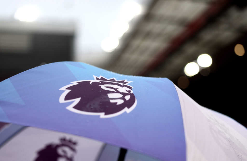 The Premier League logo on an umbrella during a game between Liverpool and Arsenal.