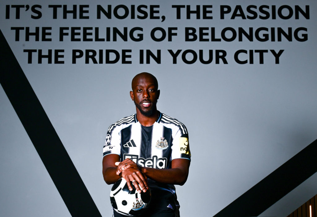 Yoane Wissa poses for photographs after signing for Newcastle United.