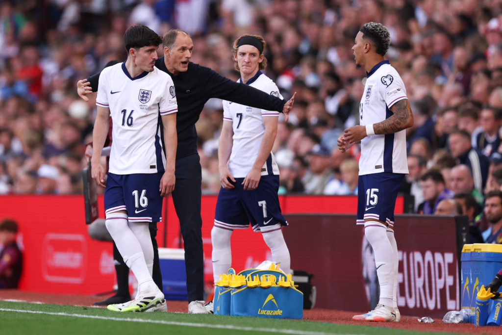England head coach Thomas Tuchel gives instructions to Tino Livramento and Anthony Gordon.