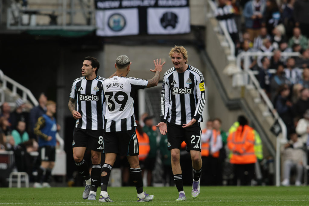 Bruno Guimaraes and Nick Woltemade celebrate after a goal in the Premier League game between Newcastle United and Wolves.