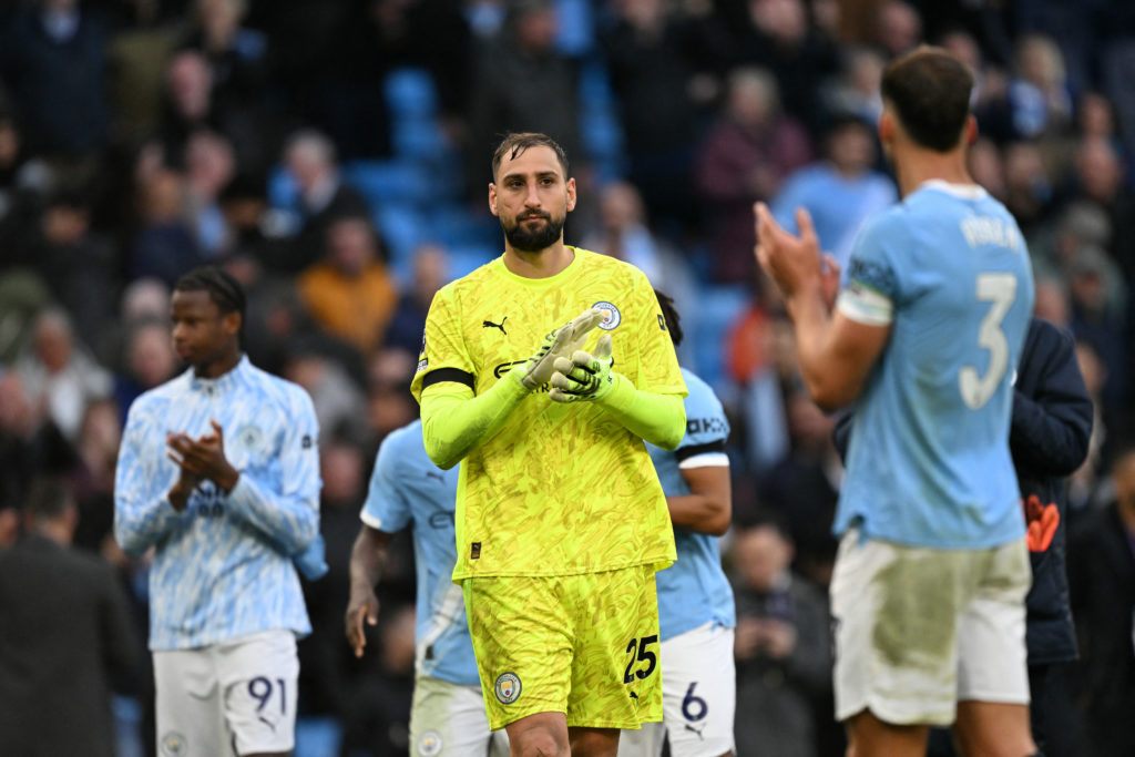 Gianluigi Donnarumma applauds the fans after Manchester City's win over Manchester United.