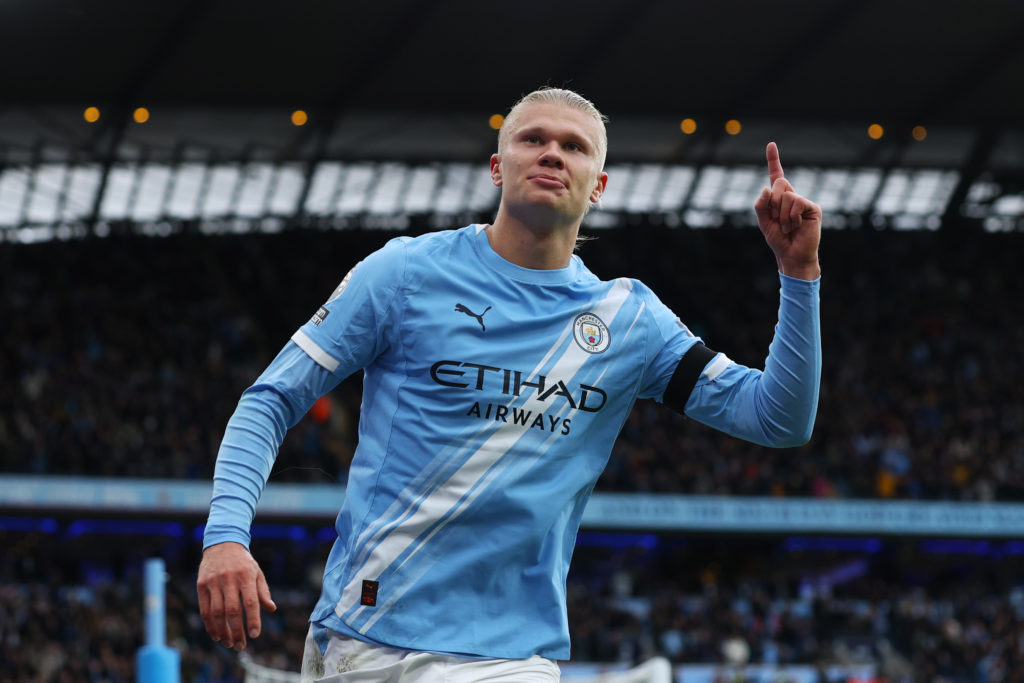 Erling Haaland celebrates scoring for Manchester City against Manchester United.