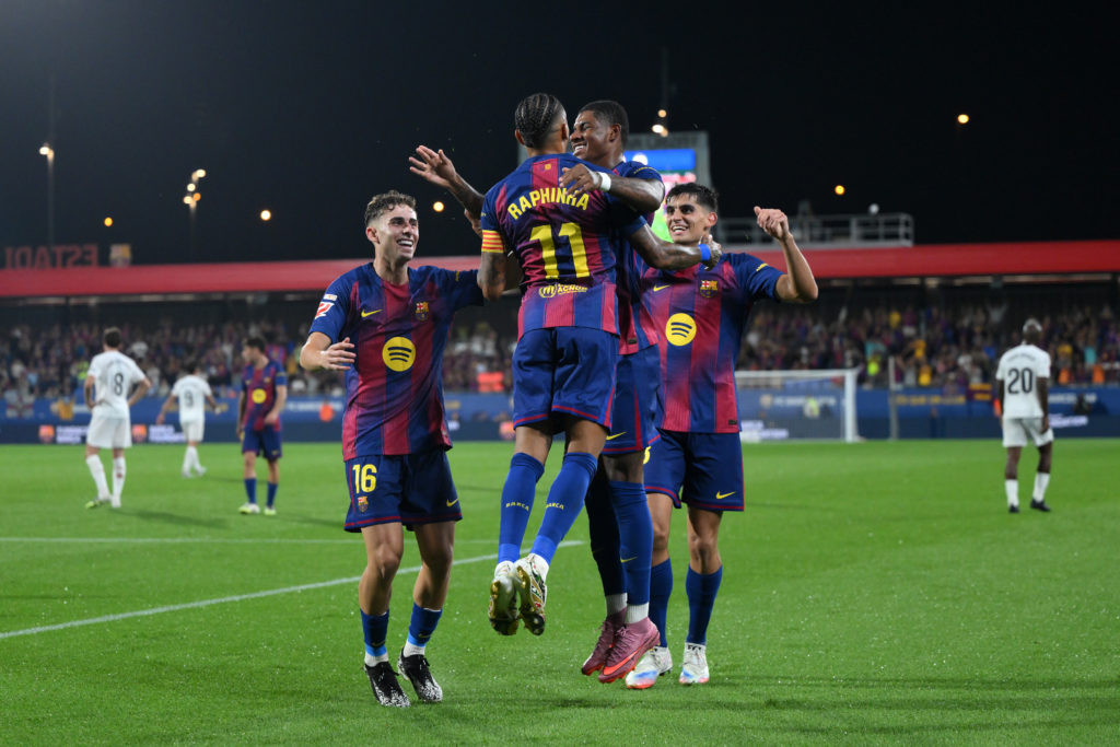 FC Barcelona players celebrate during a La Liga game between Barcelona and Valencia.