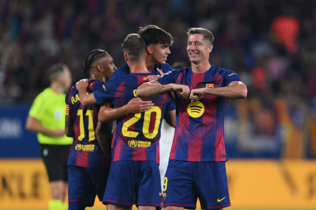 Robert Lewandowski celebrates scoring for Barcelona against Valencia in La Liga.