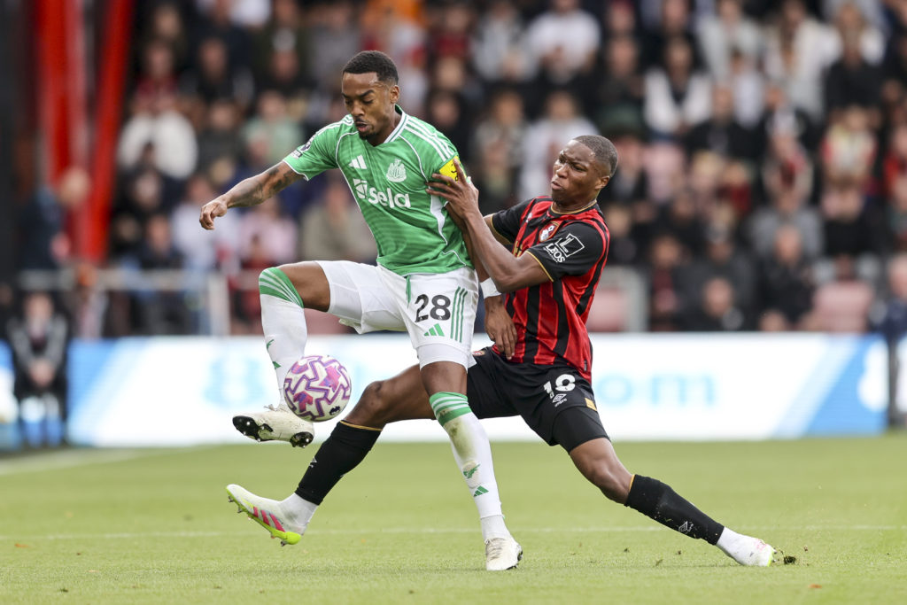 Joe Willock is challenged for the ball during Newcastle United's Premier League game against Bournemouth.