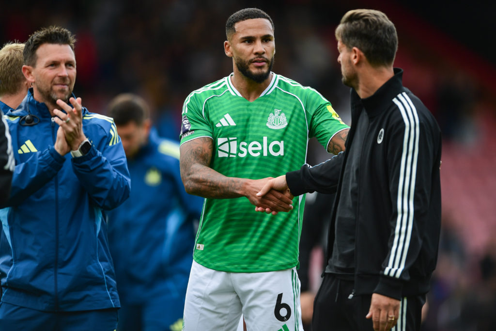 Jamaal Lascelles shakes Jason Tindall's hand after a Premier League game between Bournemouth and Newcastle United.