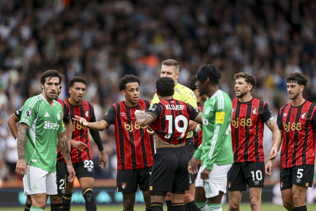 Newcastle United and Bournemouth players crowd around the referee during a Premier League at the Vitality Stadium.