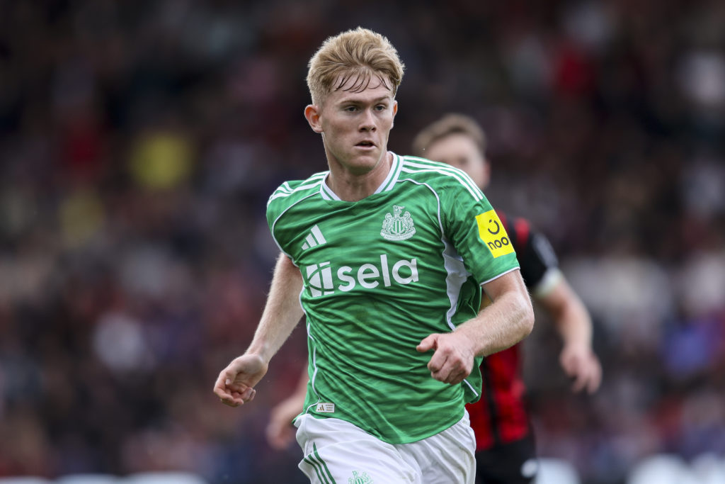 Lewis Hall is in action for Newcastle United against Bournemouth.