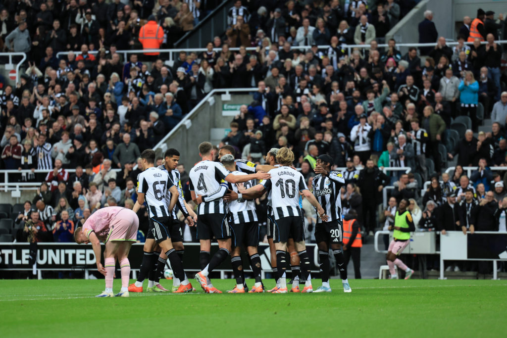 Newcastle United players celebrate William Osula's goal.