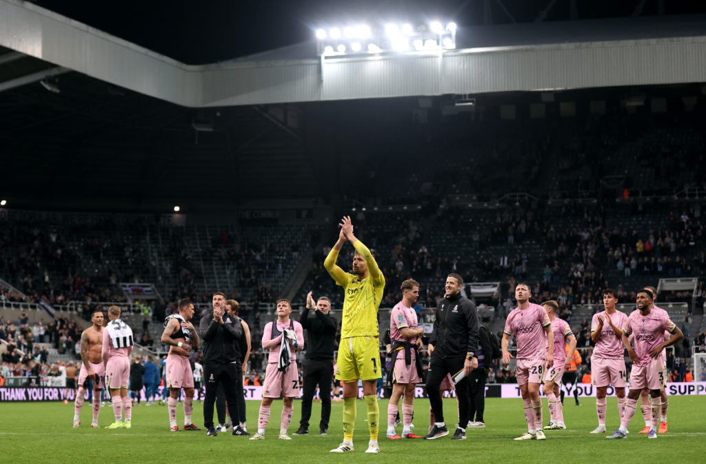 Bradford City players and coaching staff claps their supporters after losing to Newcastle United in the Carabao Cup at St James' Park.