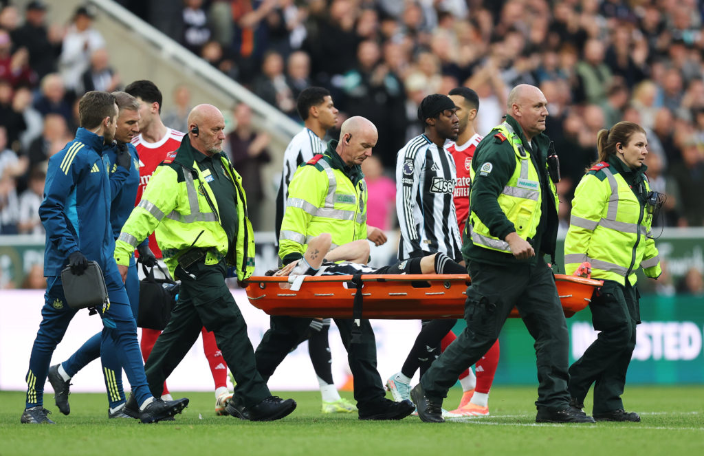 Tino Livramento is stretchered off for Newcastle United against Arsenal.