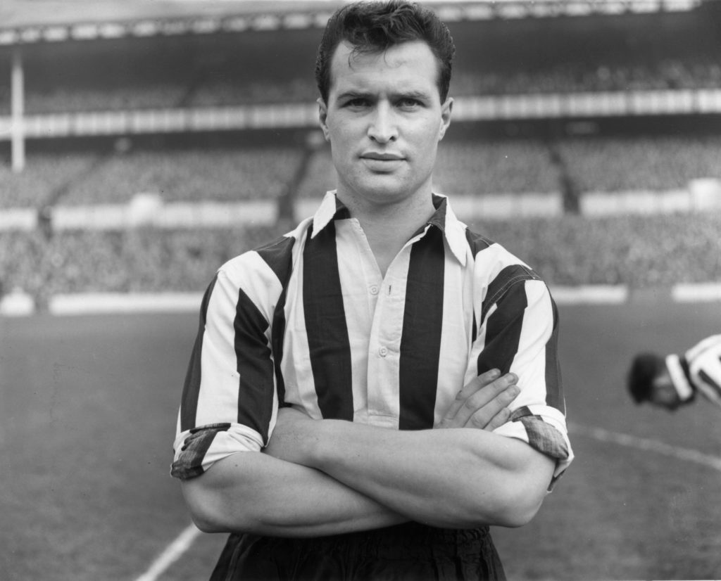 Len White folds his arms in 1956.