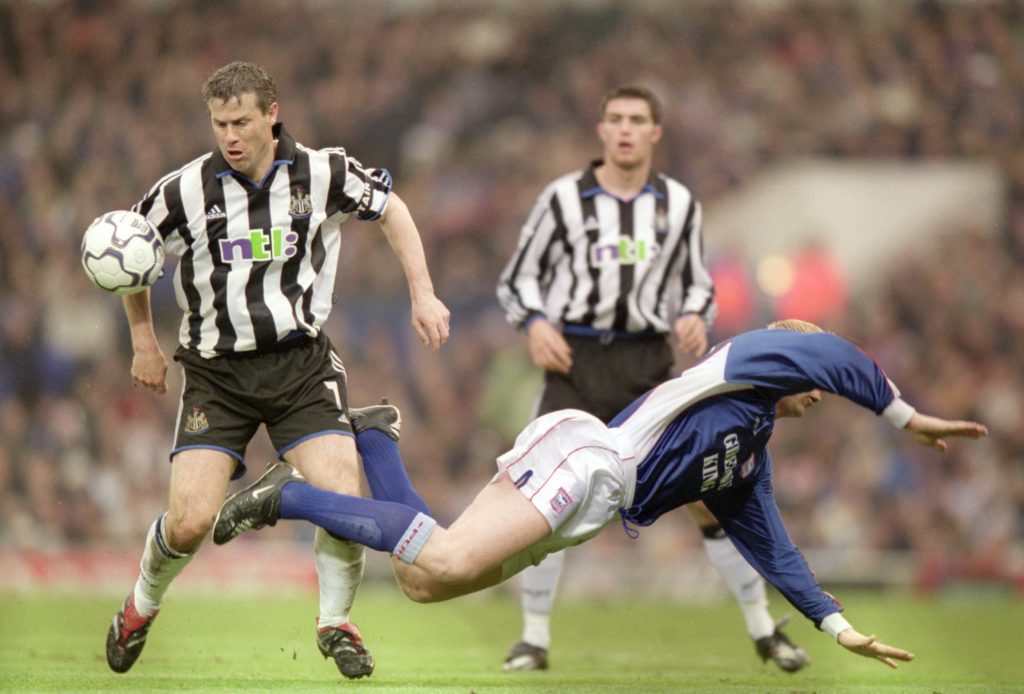 Rob Lee and Alun Armstrong challenge for the ball during a Premier League game between Newcastle United and Ipswich Town.