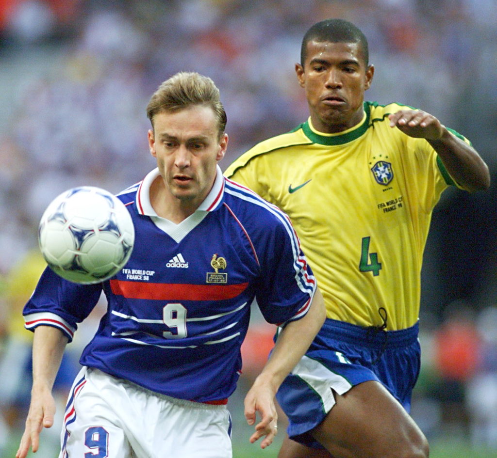 France striker Stephane Guivarc'h is challenged by Brazilian Junior Baiano in the 1998 World Cup final.
