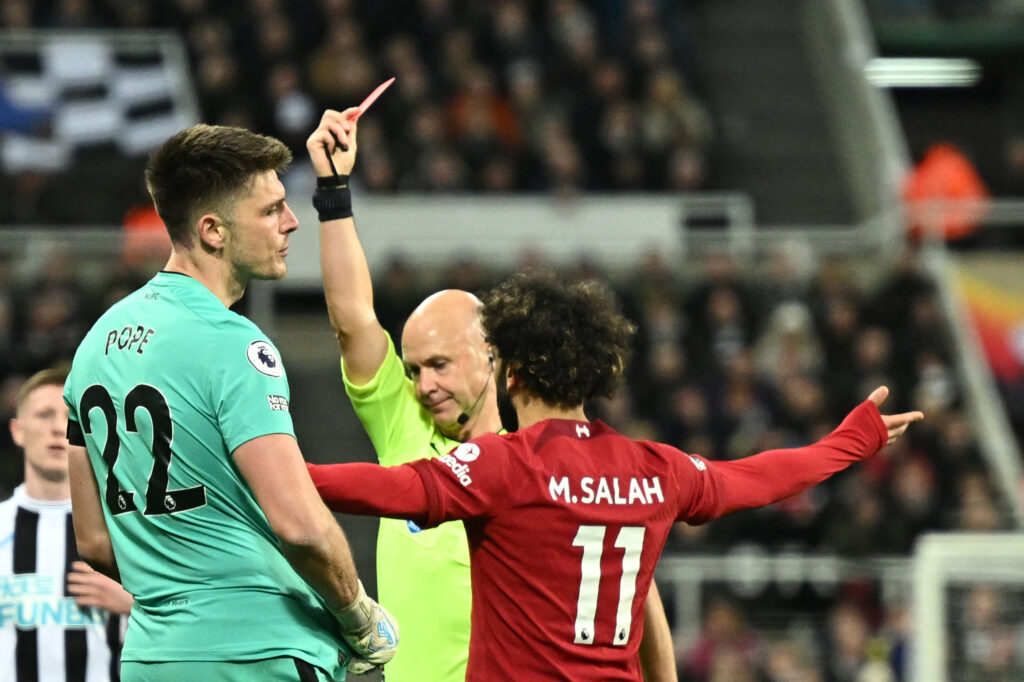 Nick Pope reacts after the Newcastle United goalkeeper is sent off against Liverpool.
