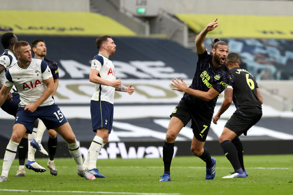 Newcastle United striker Andy Carroll calls for a penalty after the ball hit Tottenham defender Eric Dier on the arm.