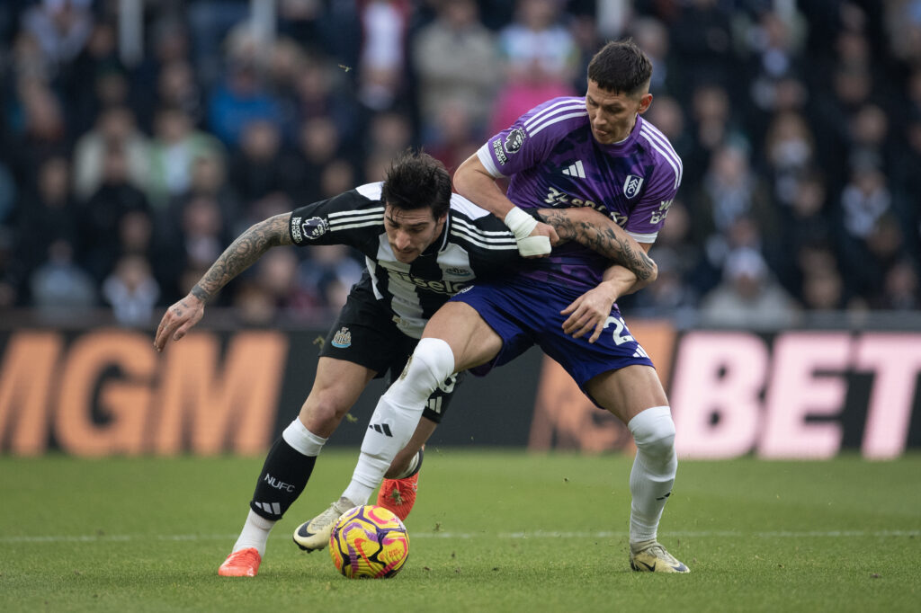 Sandro Tonali and Sasa Lukic battle for possession during Newcastle United vs Fulham at St James' Park.