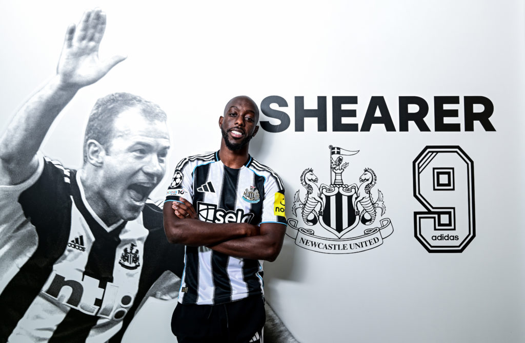 Yoane Wissa poses next to a picture of Alan Shearer after signing for Newcastle United.