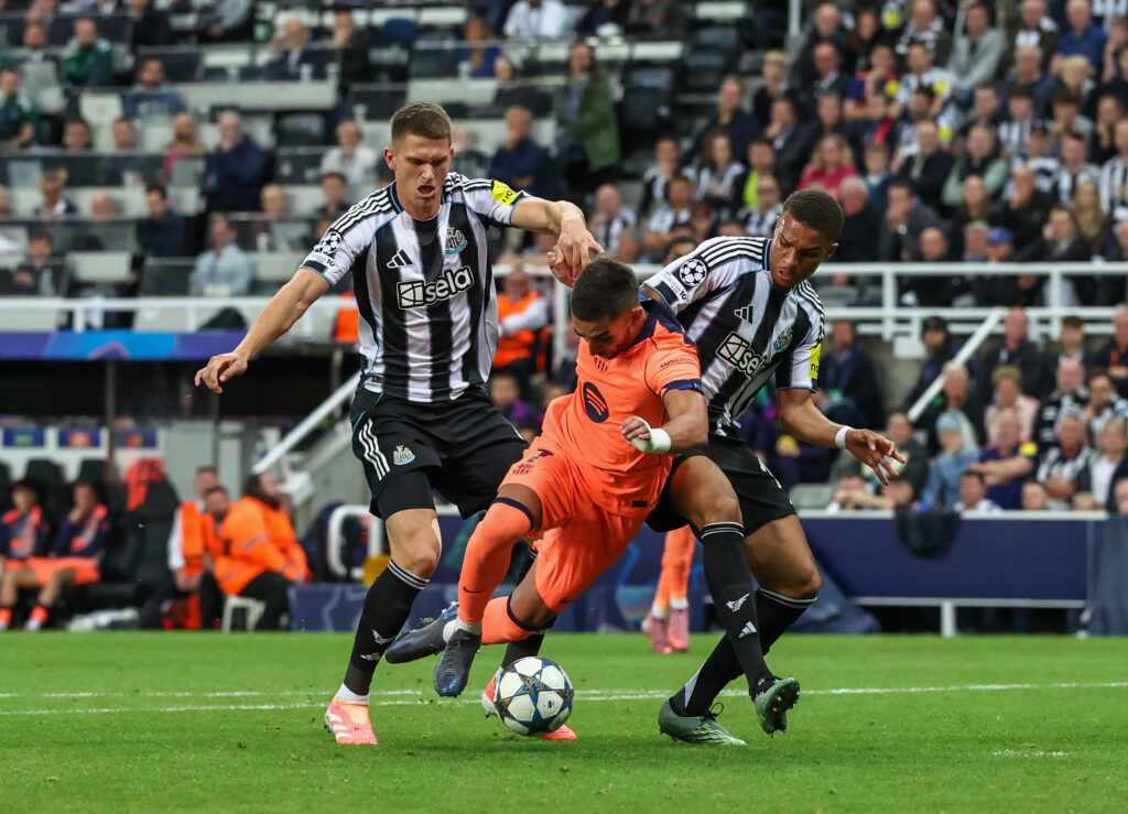 Sven Botman and Malick Thiaw challenge Ferran Torres during Newcastle United vs Barcelona in the Champions League.