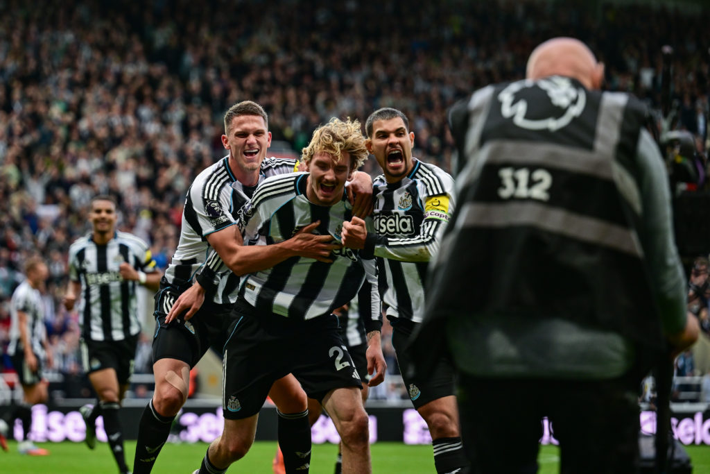 Nick Woltemade celebrates with Sven Botman and Bruno Guimaraes after scoring for Newcastle United against Arsenal.