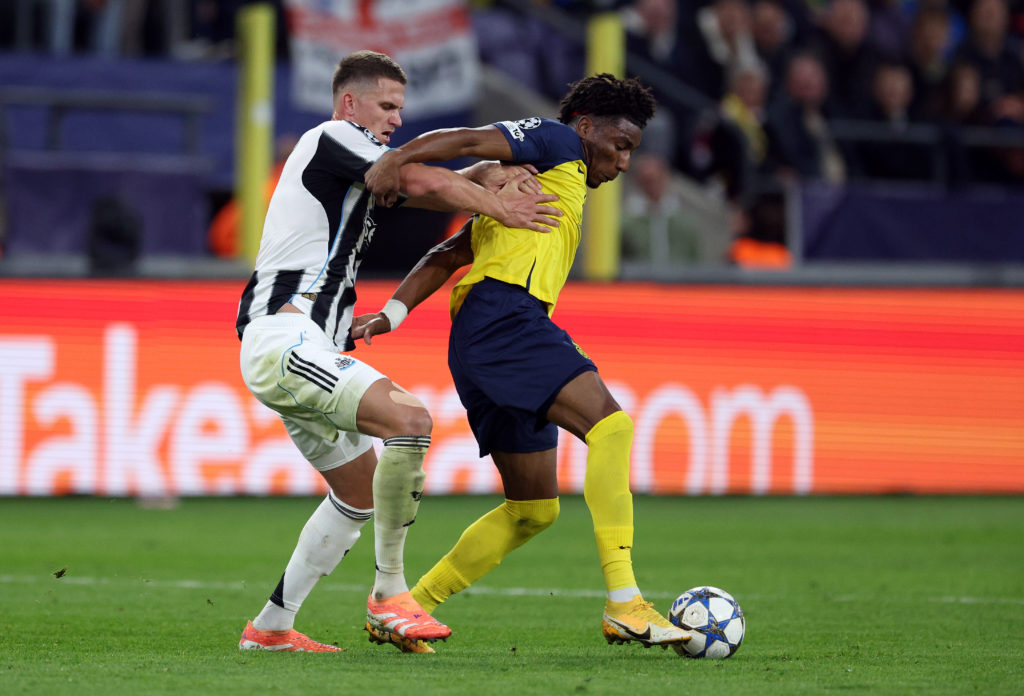 Sven Botman tackles Kevin Rodriguez during Union Saint-Gillose vs Newcastle United in the Champions League.