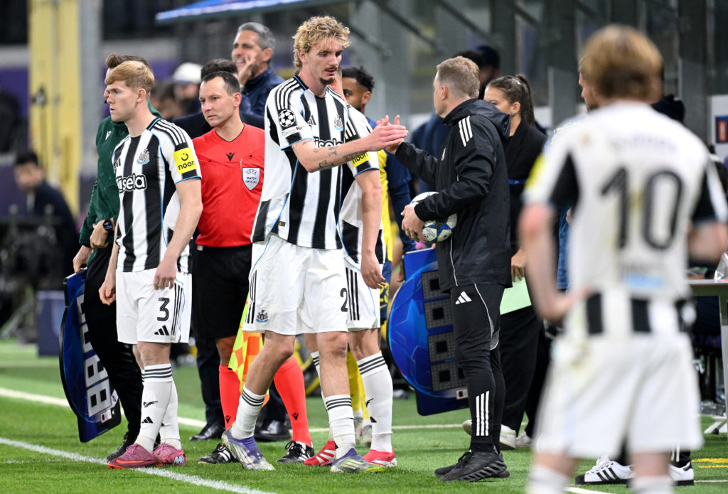 Eddie Howe and Nick Woltemade shake hands after he is substituted during Newcastle United's game against Union Saint-Gilloise.