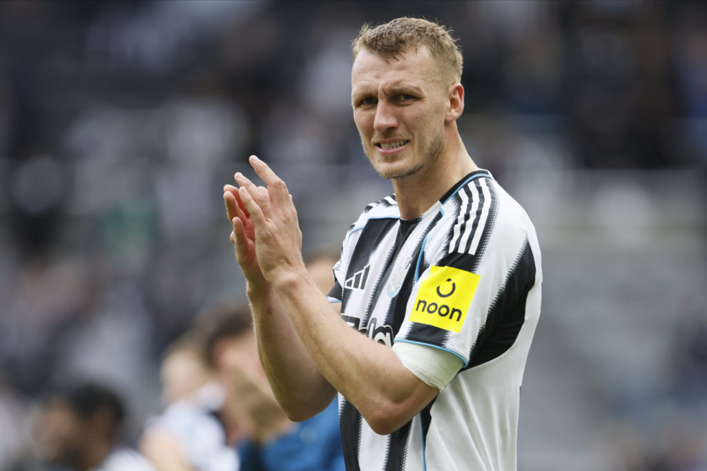 Dan Burn claps towards the Newcastle United fans after a Premier League win over Nottingham Forest.