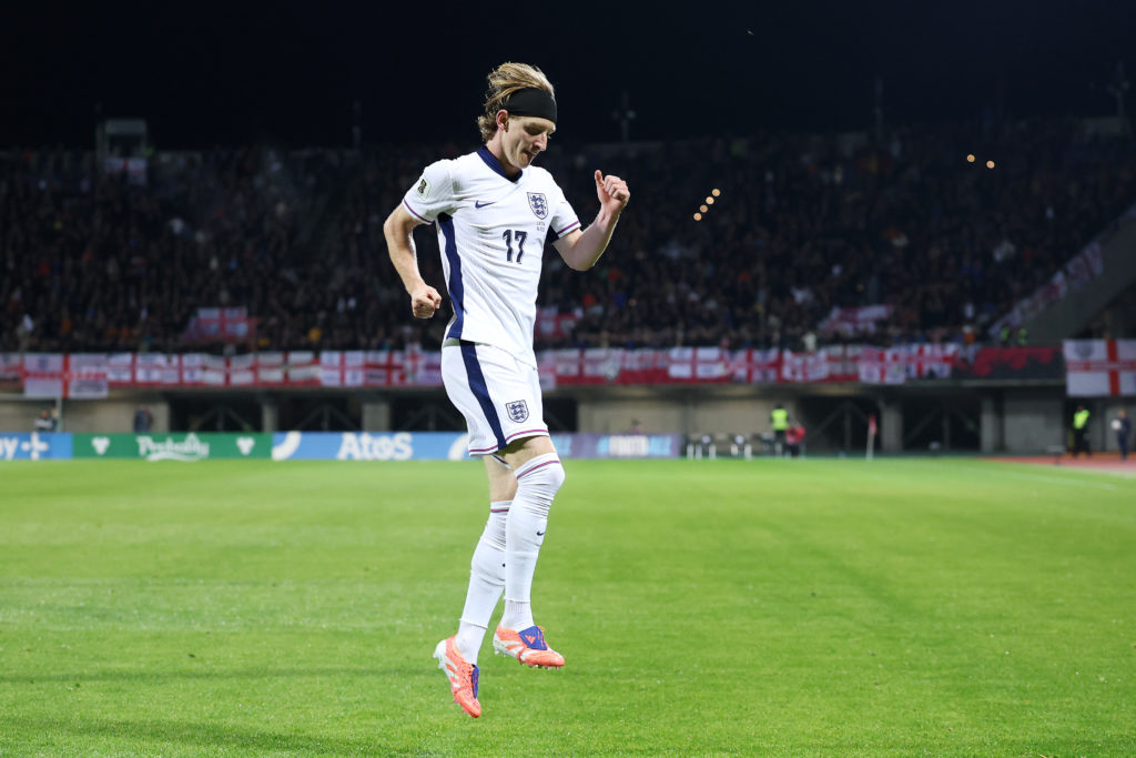 Anthony Gordon hops to celebrate his goal for England against Latvia.
