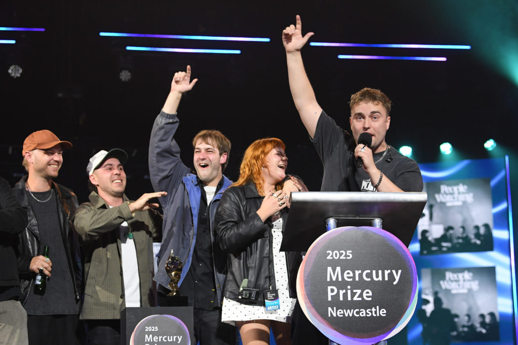 Sam Fender delivers a speech after his band won the 2025 Mercury Prize for their album People Watching.