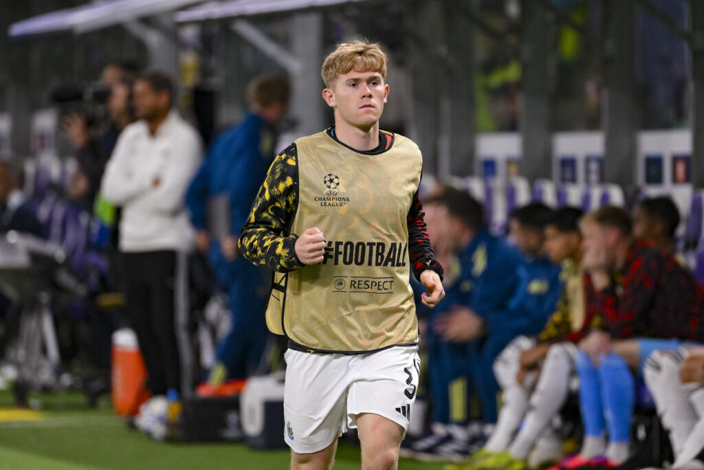 Lewis Hall warms up during Union Saint-Gilloise vs Newcastle United in the Champions League.