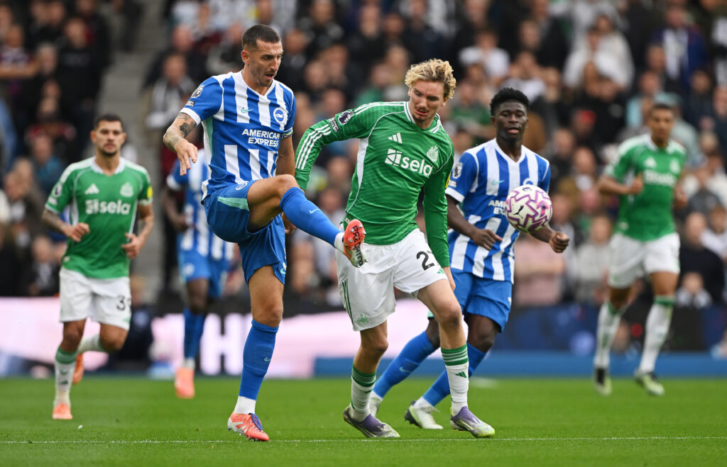Nick Woltemade challenges Lewis Dunk during Brighton vs Newcastle United.