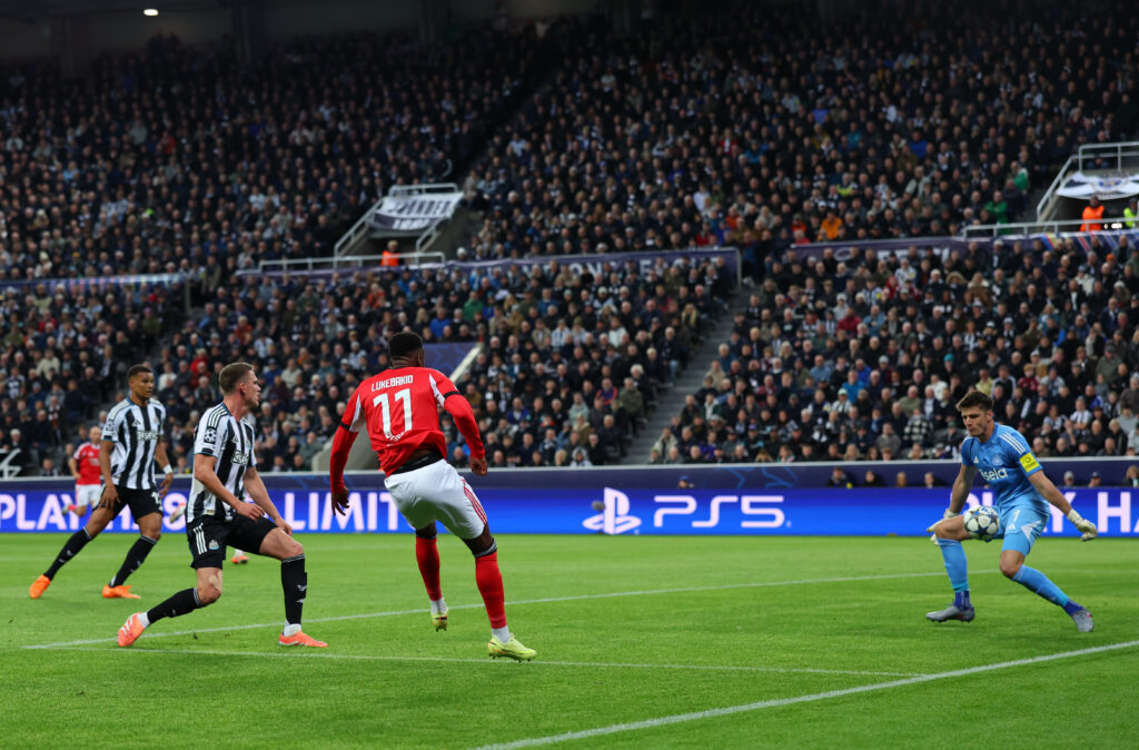 Nick Pope stops a shot with his leg for Newcastle United.