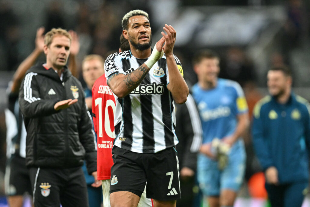 Joelinton applauds Newcastle fans.