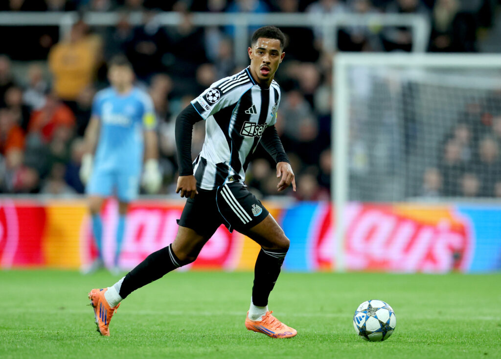 Jacob Ramsey runs with the ball during Newcastle United's Champions League game against Benfica at St James' Park.