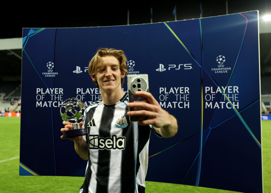 Anthony Gordon takes a selfie with his UEFA player of the match award after Newcastle United's Champions League win over Benfica.