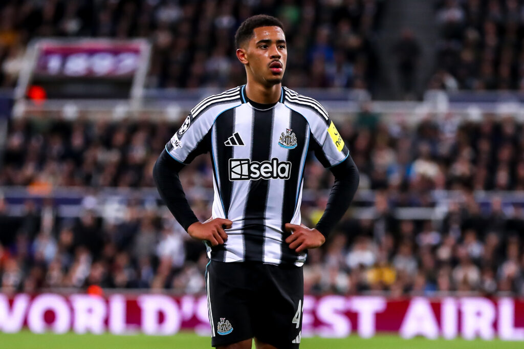 Jacob Ramsey stands with his hands on his hips during Newcastle United vs Benfica in the Champions League.