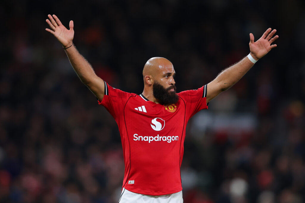 Bryan Mbeumo holds his arms in the air during Manchester United's Premier League game against Brighton.