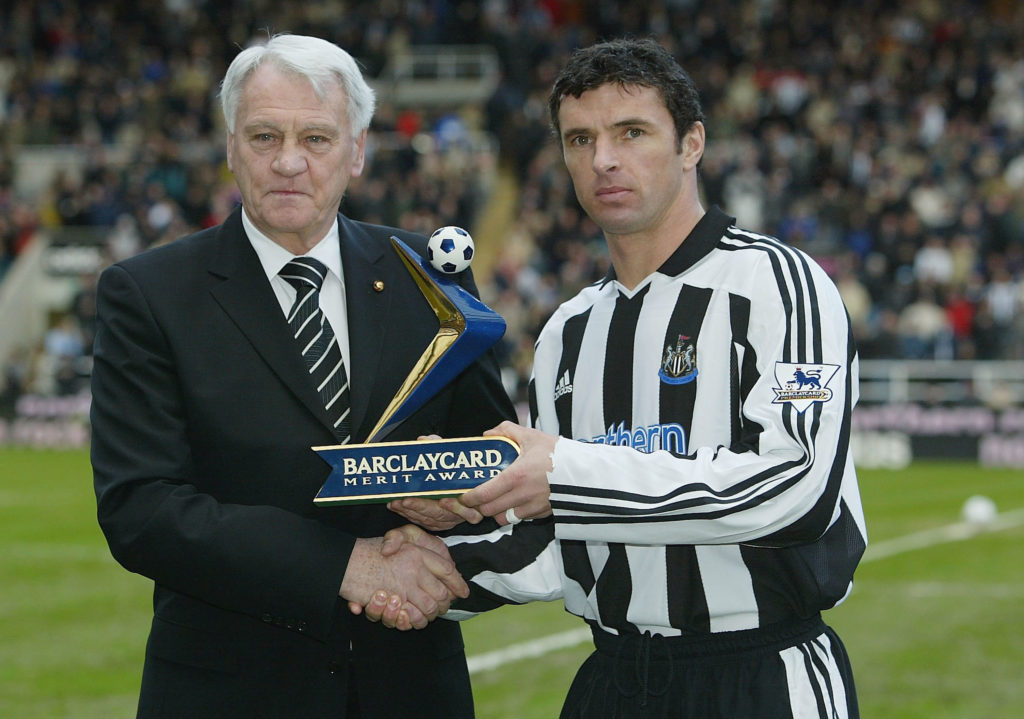 Gary Speed is presented with the Premier League Merit Award by Sir Bobby Robson.