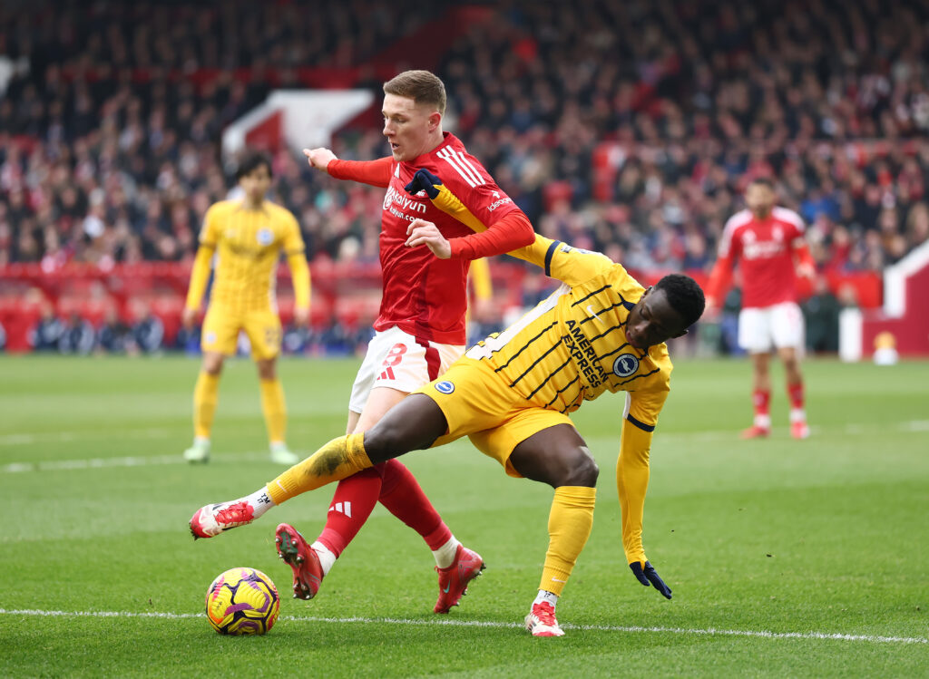 Elliott Anderson and Yankuba Minteh challenge for the ball in Nottingham Forest FC v Brighton & Hove Albion FC - Premier League