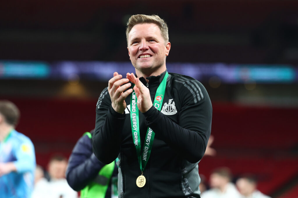 Eddie Howe claps towards fans after Newcastle United win the Carabao Cup final against Liverpool at Wembley.