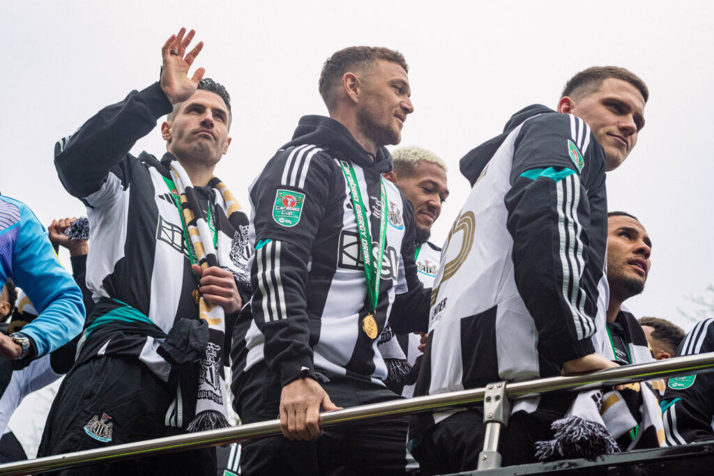 Fabian Schar, Kieran Trippier and Sven Botman on an open top bus.