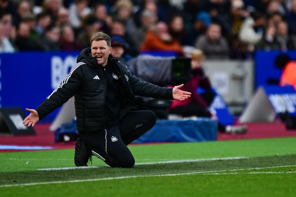 Eddie Howe crouches while angry.