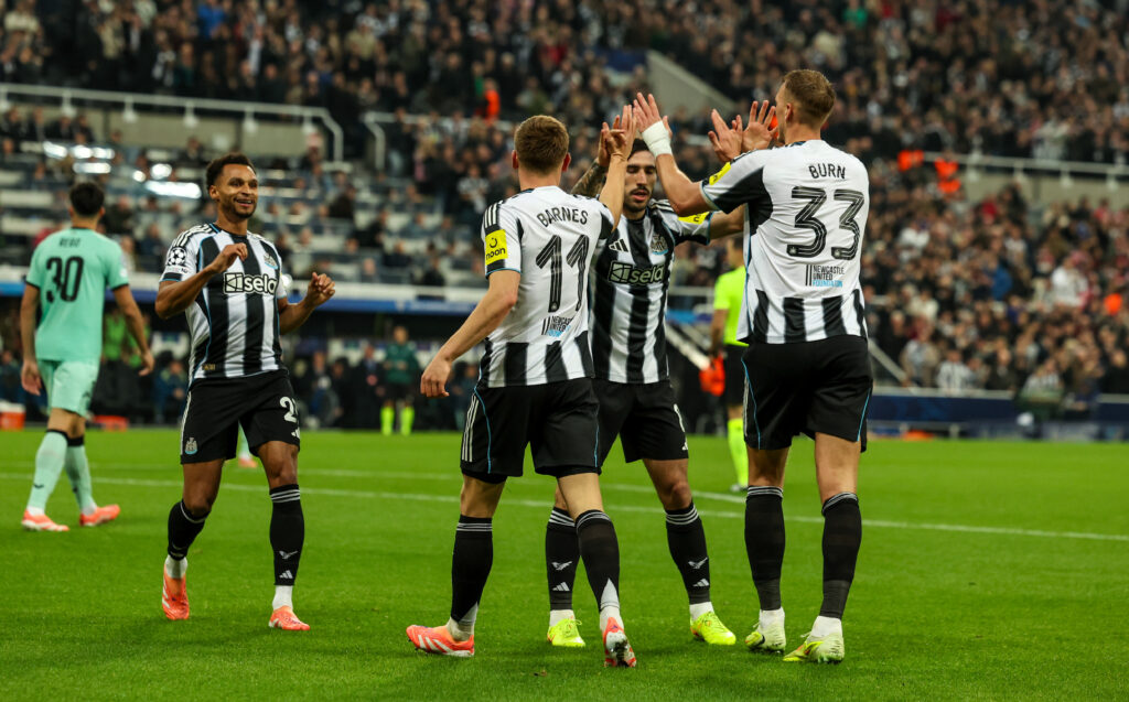 Newcastle United players celebrate Dan Burn's goal against Athletic Club.