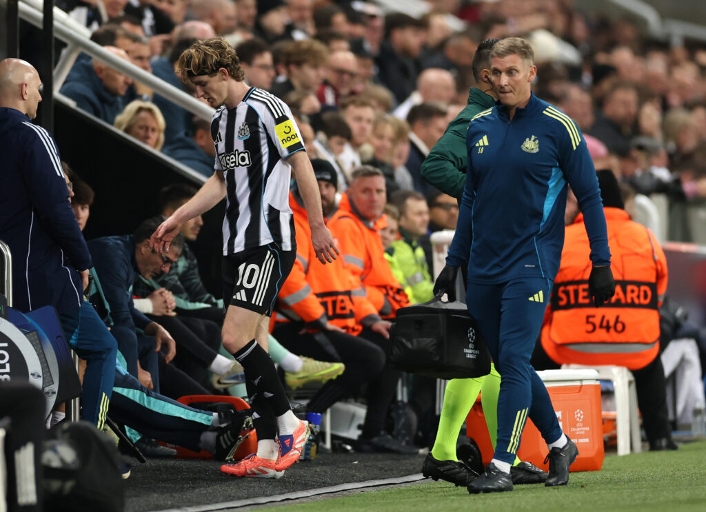 Newcastle United's Anthony Gordon is taken off with an injury in the Champions League against Athletic Club.
