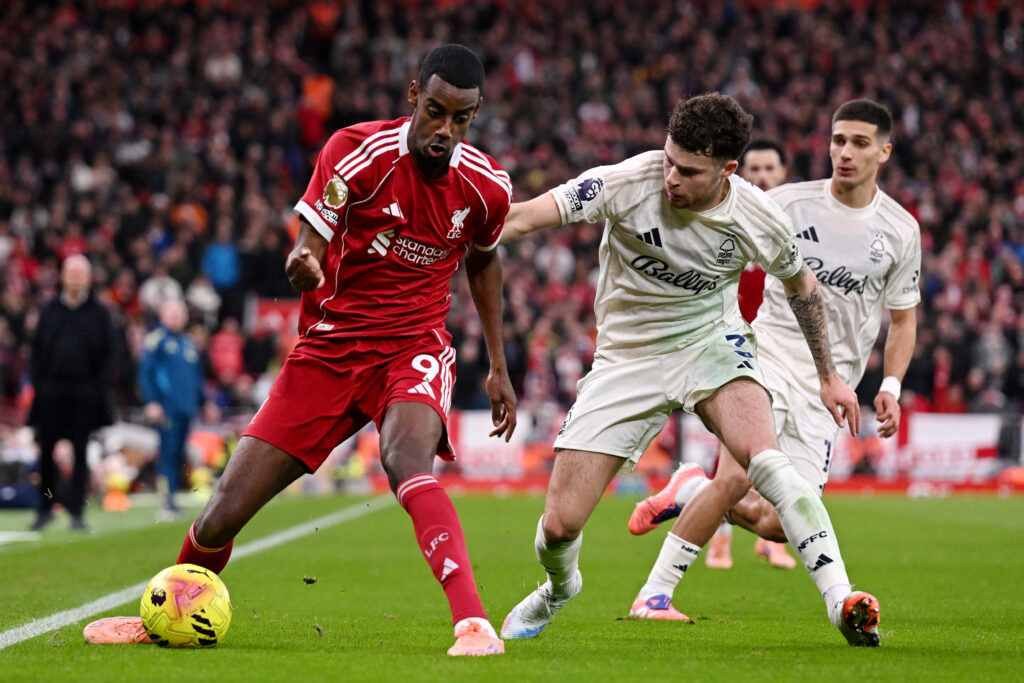 Liverpool striker Alexander Isak is challenged by Nottingham Forest defender Neco Williams.