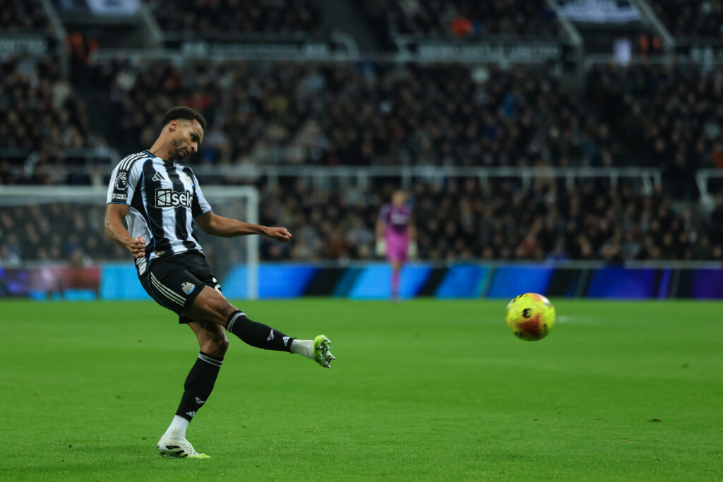 Newcastle United winger Jacob Murphy crosses the ball during a Premier League match with Manchester City.