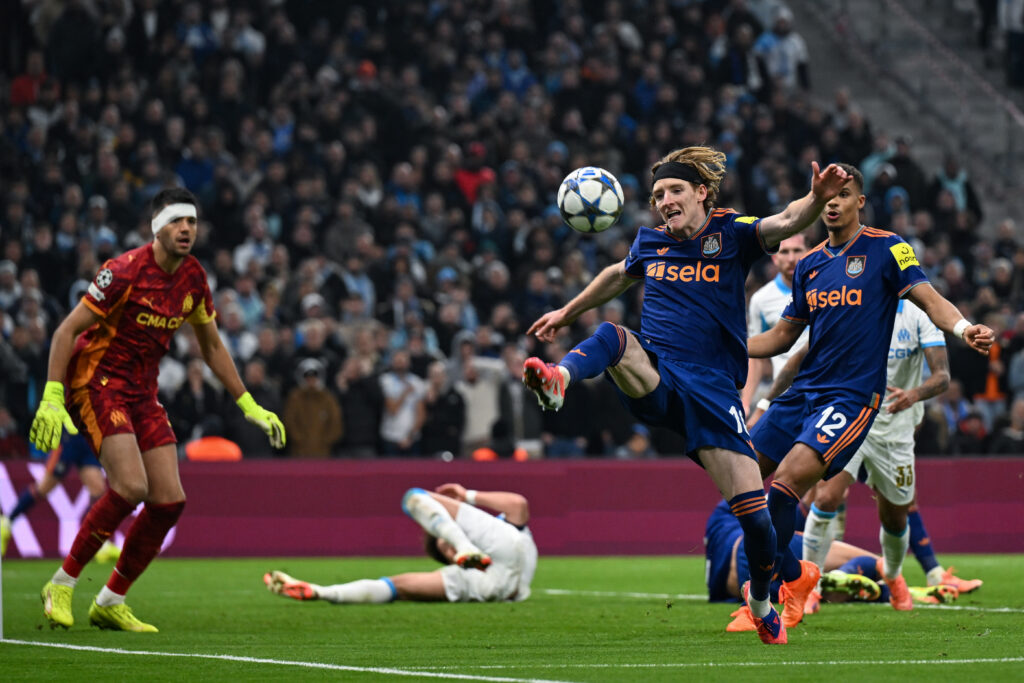 Anthony Gordon looks to control the ball during Newcastle United's Champions League game against Marseille.