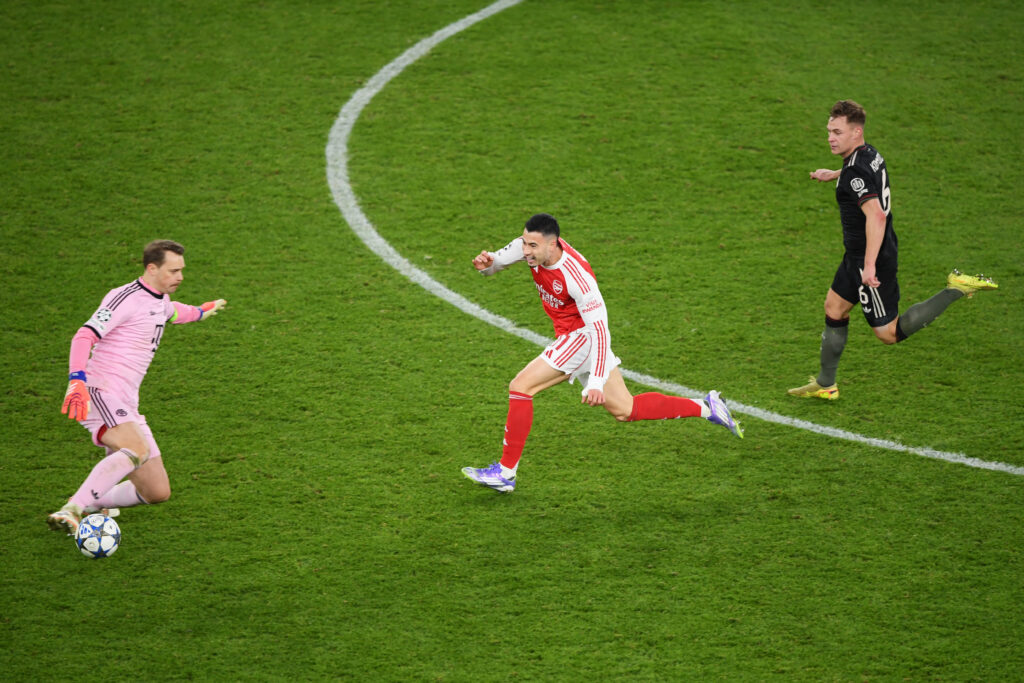 Gabriel Martinelli runs past Manuel Neuer during Arsenal vs Bayern Munich.