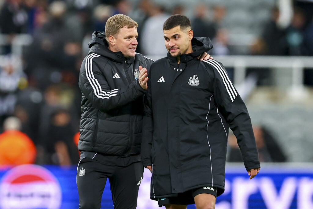 Eddie Howe speaks to Bruno Guimaraes after Newcastle United's win over Benfica.